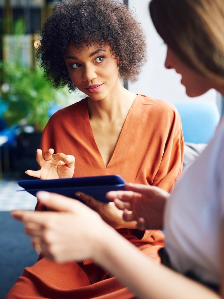 Female ABA biller working with client on tablet Female ABA biller working with client on tablet
